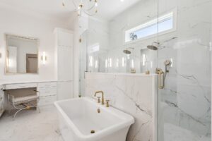 modern-luxury-master-bathroom-covington-louisiana Elegant master bathroom with a large walk-in glass shower and dual vanity in a Covington custom home.
